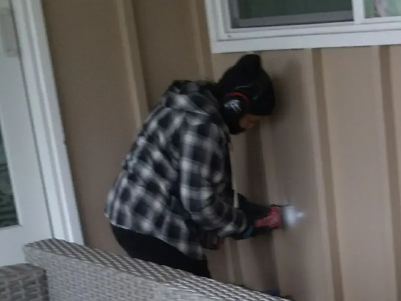 Professional electrician installing an exterior outlet in Ferndale